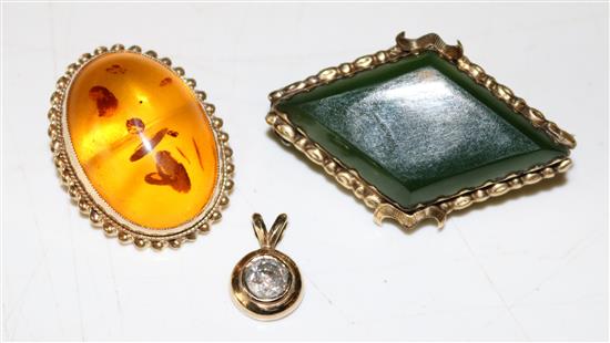 Diamond pendant, amber brooch & another